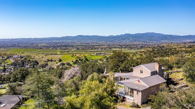 drone / aerial view featuring a mountain view