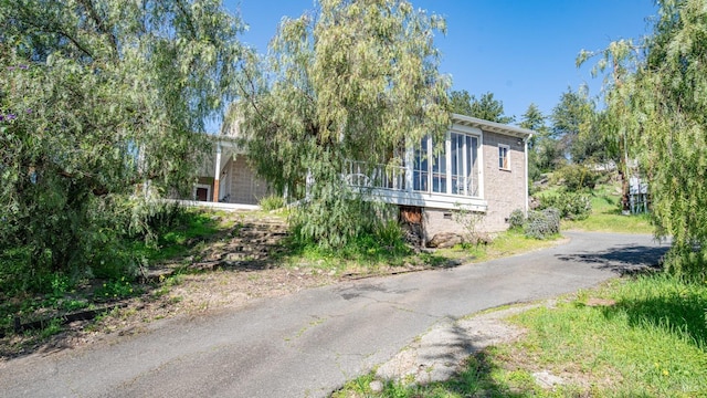 view of home's exterior featuring aphalt driveway