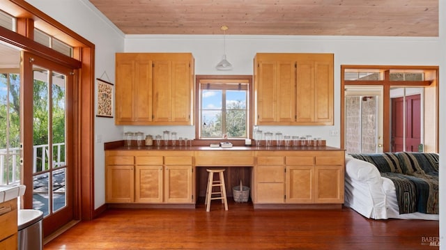 kitchen with dark wood finished floors, dark countertops, wood ceiling, and ornamental molding