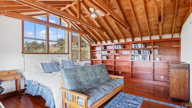 bedroom featuring wood finished floors, vaulted ceiling with beams, and wooden ceiling