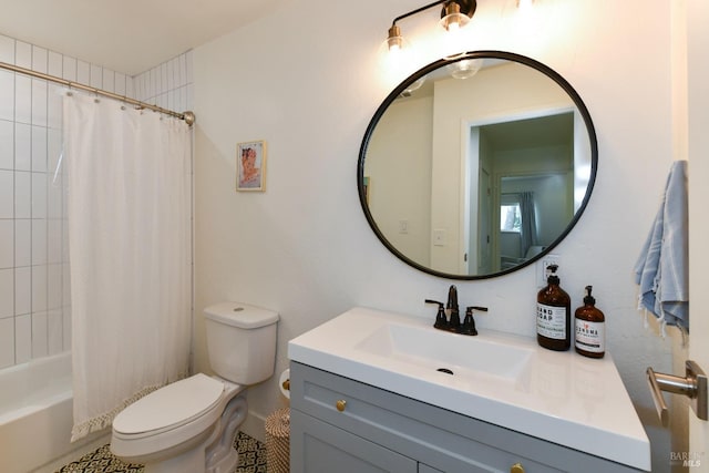 full bath with toilet, vanity, and shower / bath combo