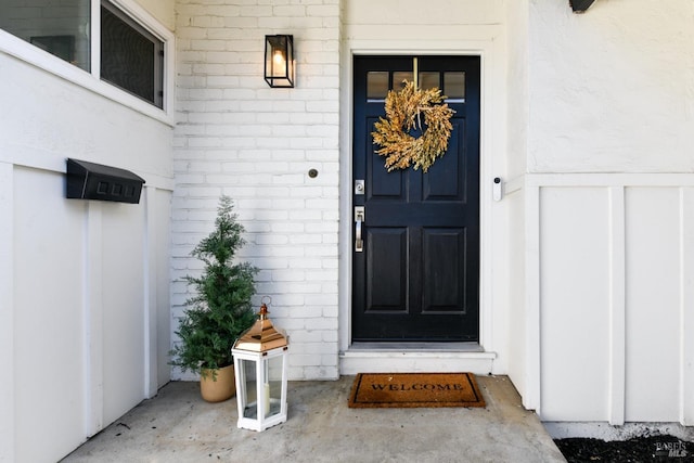 property entrance with brick siding