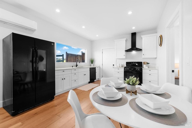 dining area with recessed lighting, light wood-style floors, and a wall unit AC