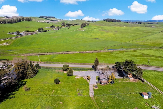 birds eye view of property with a rural view