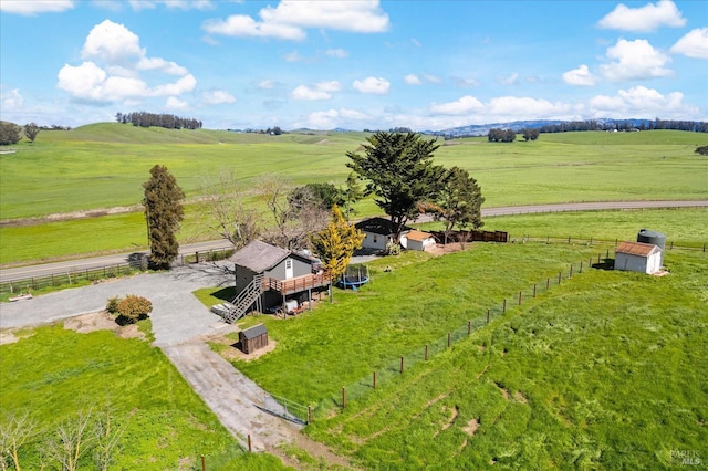 birds eye view of property with a rural view