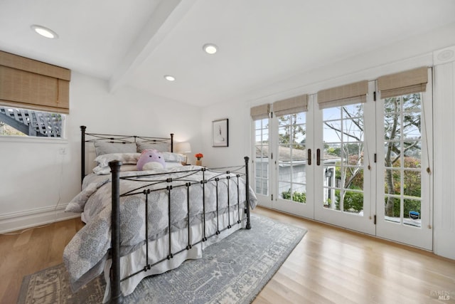 bedroom featuring beam ceiling, recessed lighting, wood finished floors, and access to outside