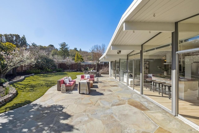 view of patio / terrace featuring an outdoor hangout area and a fenced backyard