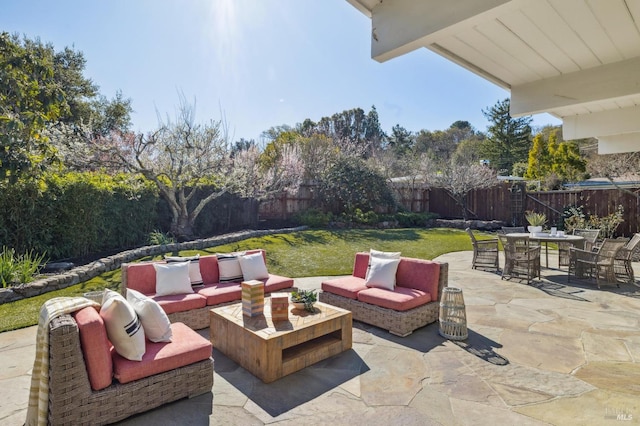view of patio featuring an outdoor living space, outdoor dining area, and a fenced backyard