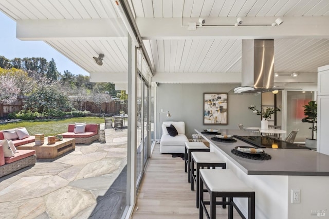 view of patio / terrace featuring outdoor dry bar and outdoor lounge area