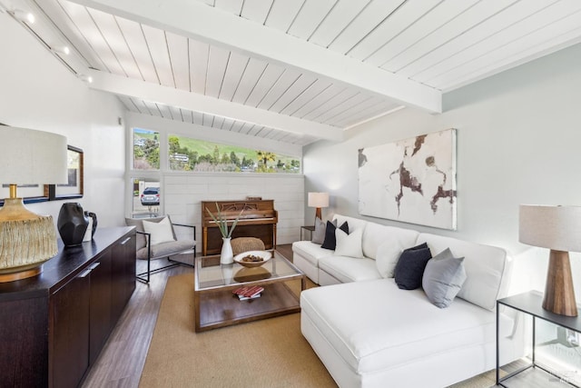 living area with lofted ceiling with beams, light wood-style flooring, and wood ceiling