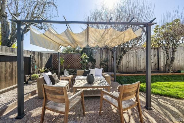 view of patio featuring outdoor lounge area and a fenced backyard