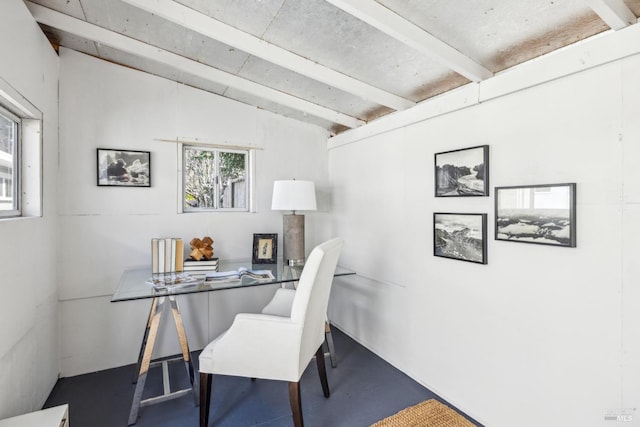 office area with beam ceiling and finished concrete flooring