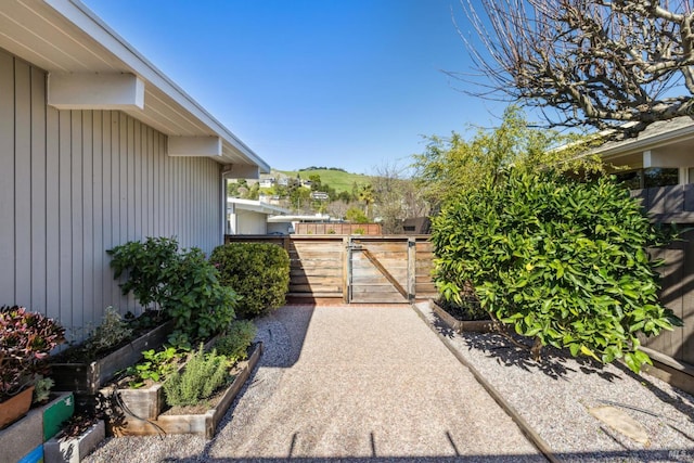 exterior space with a vegetable garden and fence