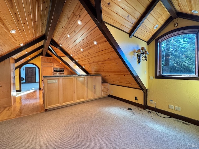 bonus room featuring lofted ceiling with beams, visible vents, light carpet, and baseboards