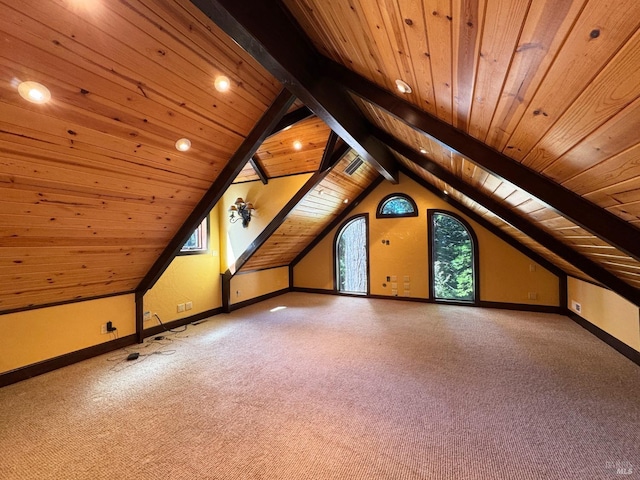 additional living space featuring lofted ceiling with beams, baseboards, carpet, and wood ceiling