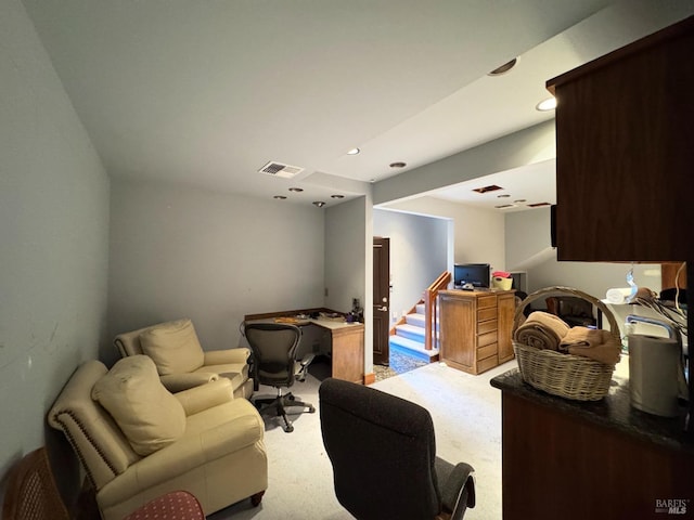 living area featuring recessed lighting, visible vents, light carpet, and stairway