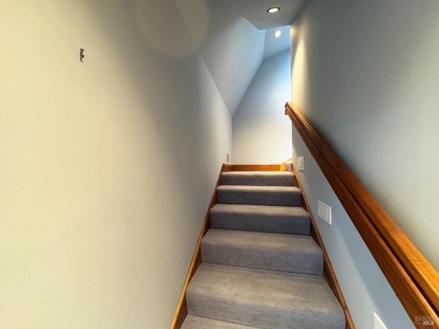 stairway with vaulted ceiling, recessed lighting, carpet, and baseboards