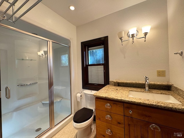 full bath with toilet, a stall shower, and vanity