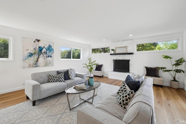 living room with plenty of natural light and wood finished floors