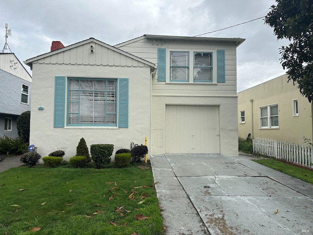 view of front of home with driveway, a front lawn, and fence