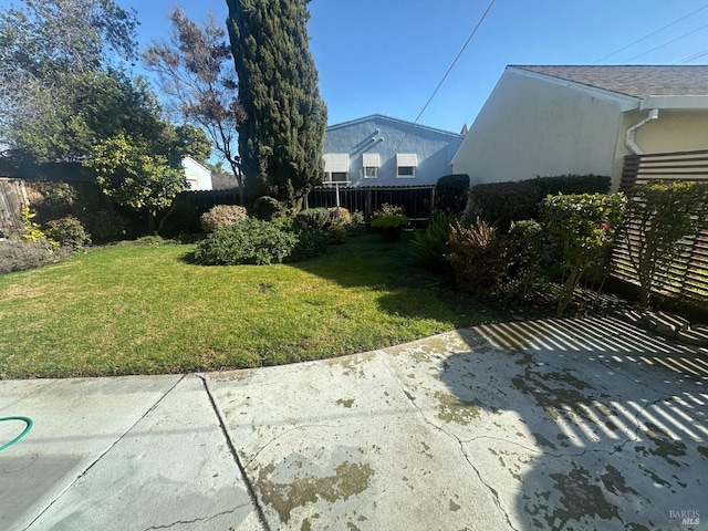 view of yard featuring a patio and fence