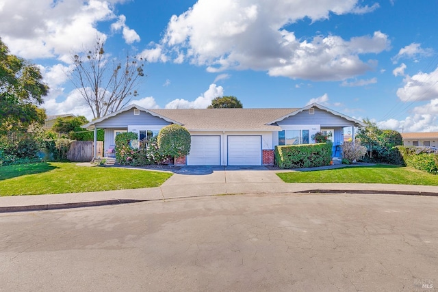 view of front of property with fence, a front lawn, concrete driveway, a garage, and brick siding