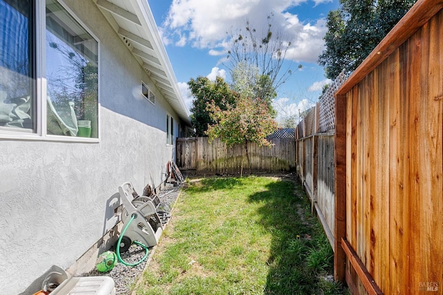 view of yard with a fenced backyard