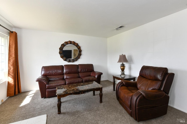 carpeted living room with visible vents