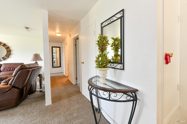 hallway with light carpet