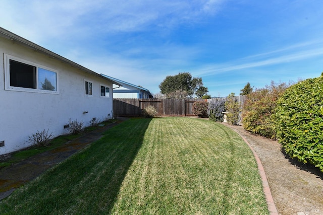 view of yard featuring a fenced backyard