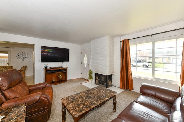 living area featuring carpet flooring and a fireplace