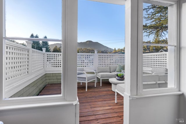 wooden deck with a mountain view