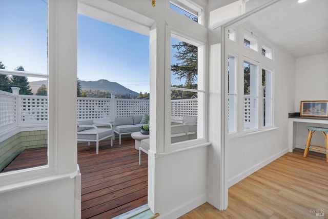 sunroom / solarium with a mountain view