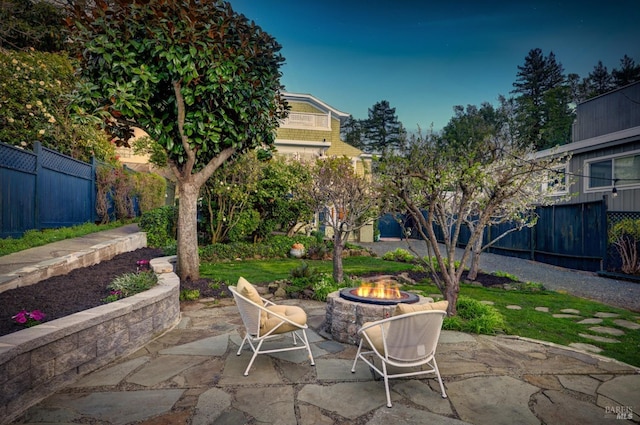 view of patio with fence and an outdoor fire pit