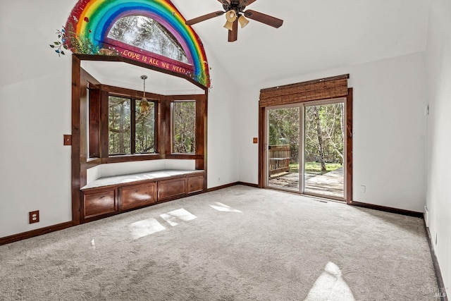 interior space featuring baseboards, high vaulted ceiling, and ceiling fan