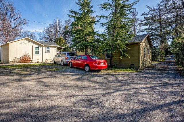 view of side of home featuring crawl space