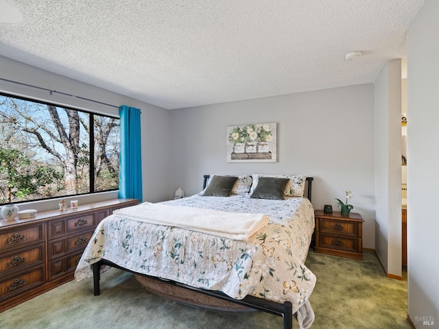 carpeted bedroom featuring a textured ceiling