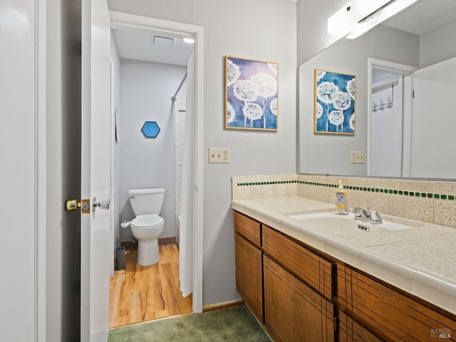 bathroom featuring vanity, baseboards, visible vents, curtained shower, and toilet