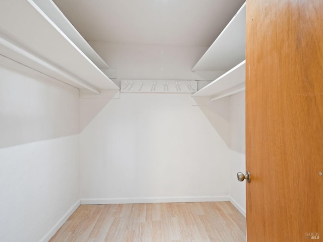 spacious closet with wood finished floors