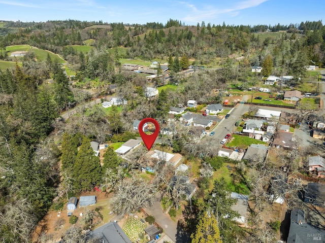 drone / aerial view featuring a forest view