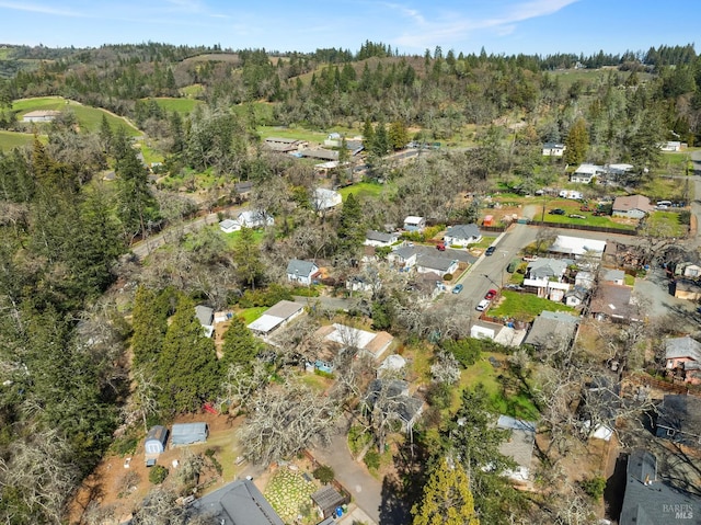 birds eye view of property with a forest view