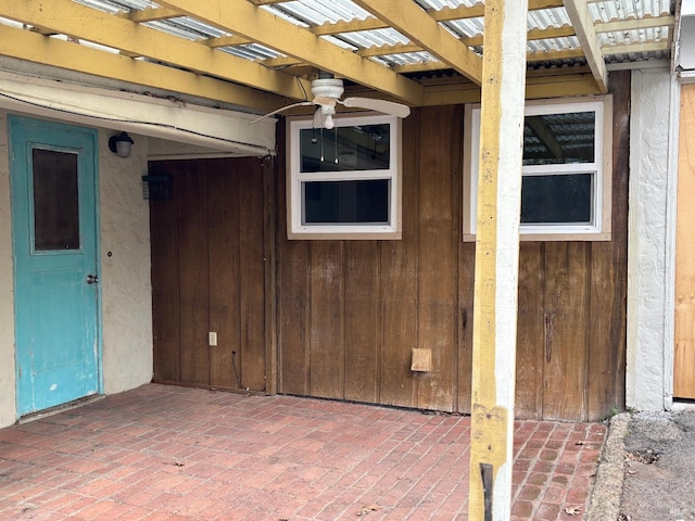 doorway to property featuring a pergola