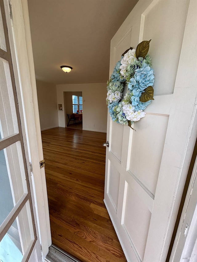 hall with wood finished floors