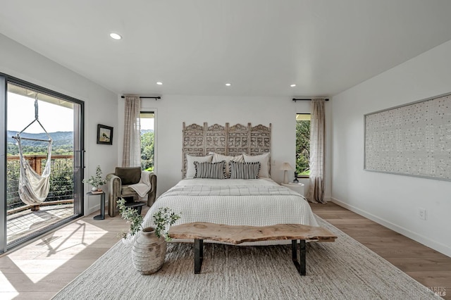 bedroom with access to outside, recessed lighting, baseboards, and light wood finished floors