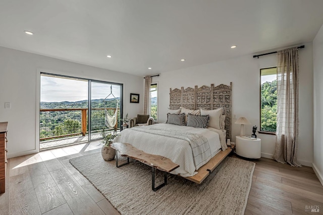 bedroom featuring access to outside, recessed lighting, baseboards, and hardwood / wood-style flooring