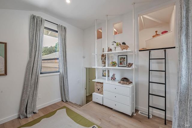 bedroom with visible vents, baseboards, and light wood-style floors