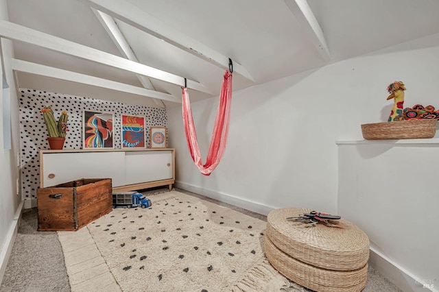 bathroom with lofted ceiling with beams and baseboards