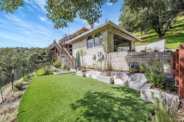 exterior space featuring stairway and a fenced backyard