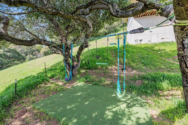 surrounding community featuring a lawn and fence