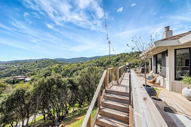 wooden terrace with a mountain view and a forest view